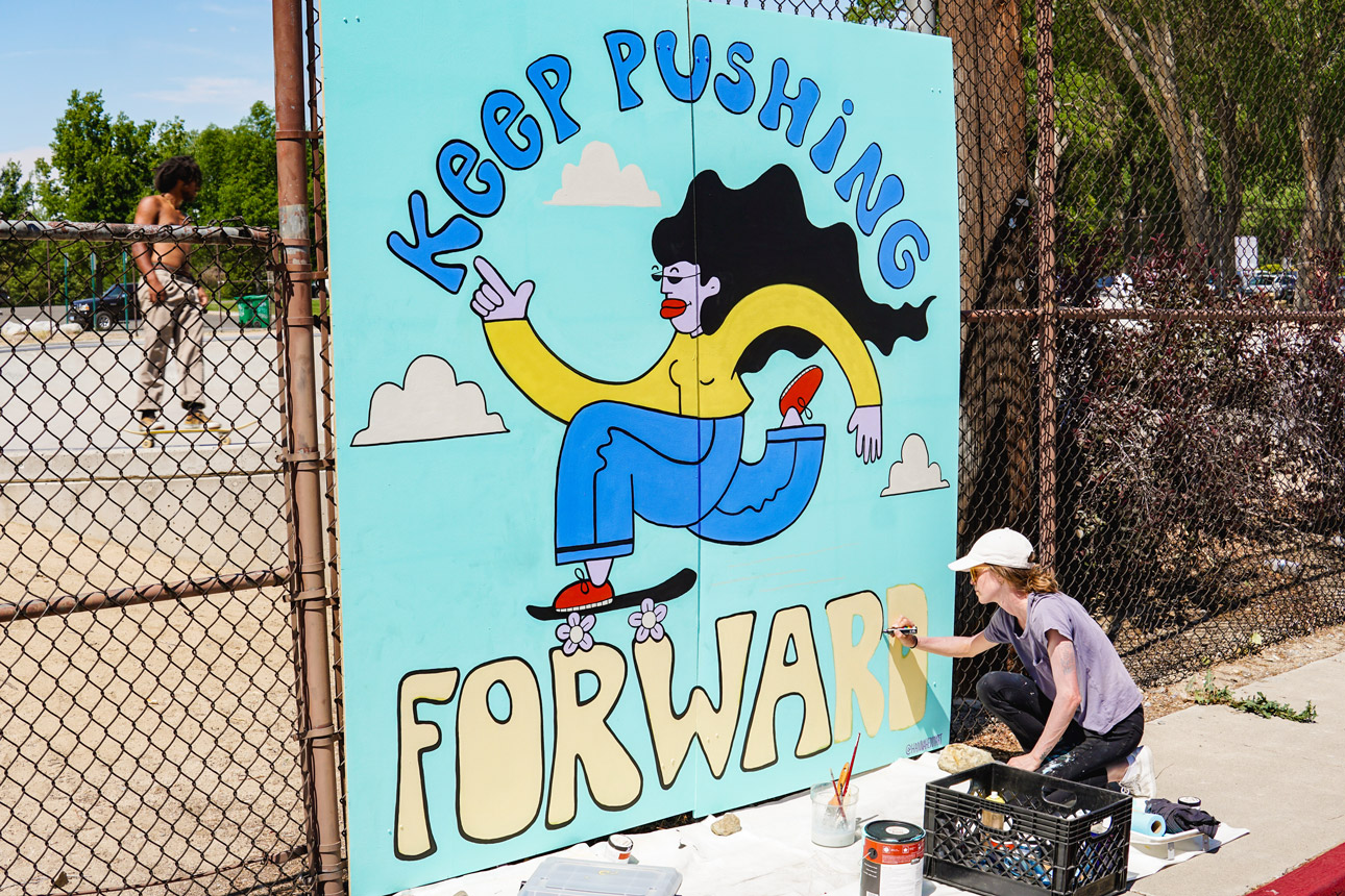 Hannah Eddy working on a skate inspired mural.