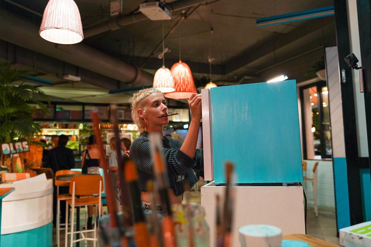 Sam Taylor with some live art action on the Red Bull fridge at the Pre Party.